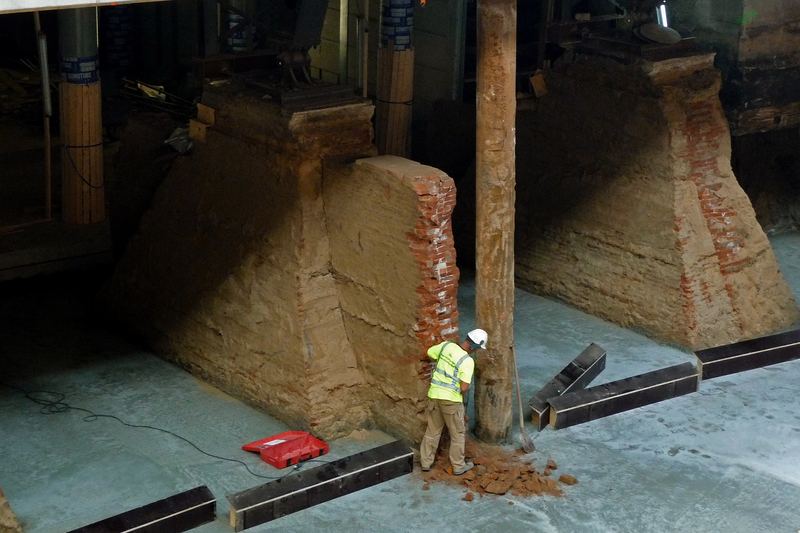 2012 - photo of a construction worker underground, in rebuilding and foundation works under the brick building of Central Station Amsterdam.